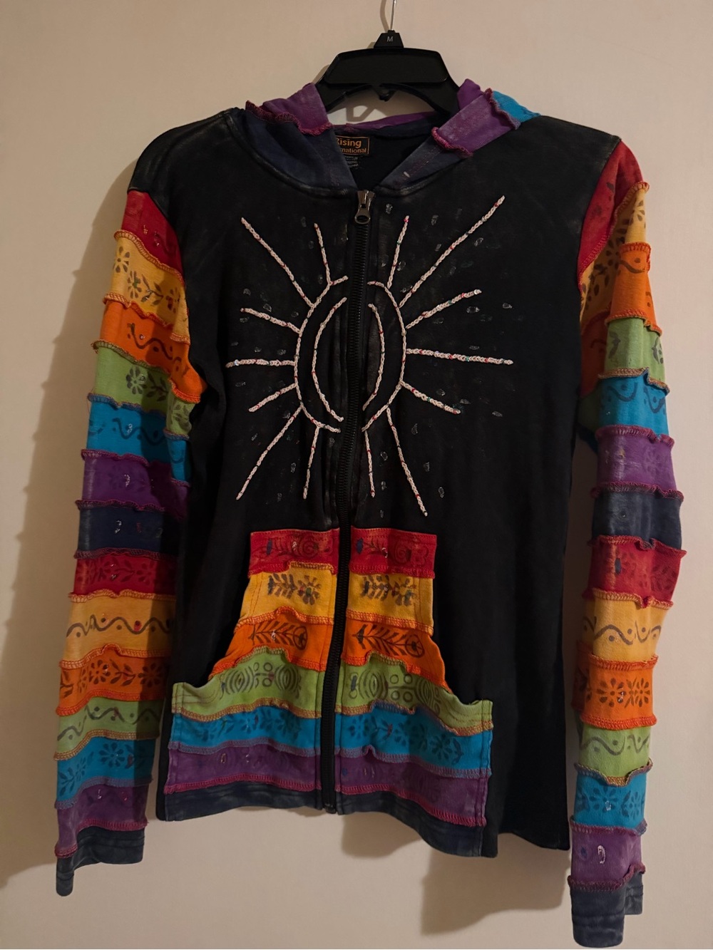 Rising International Black Zip Hoodie with Rainbow Patch Stripes